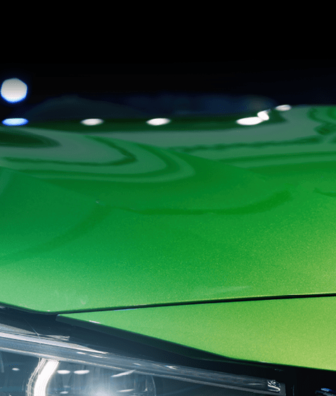 Closeup headlights of modern car during turn on light in night.